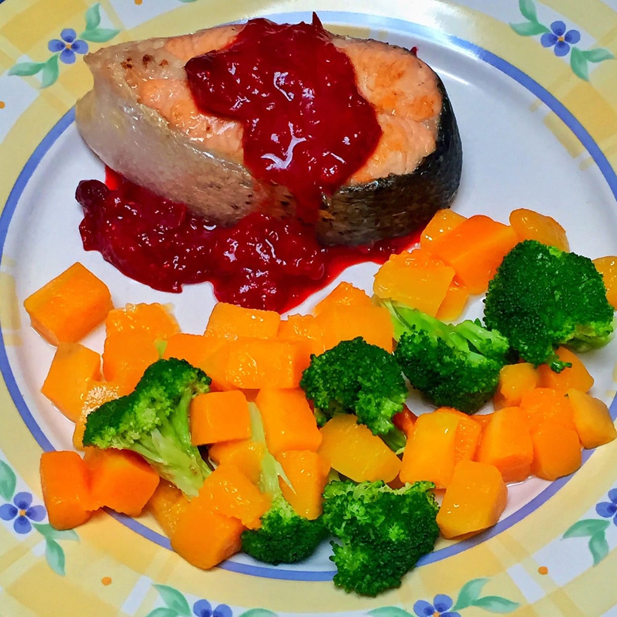 Salmon with cranberry-mustard sauce and a side of butternut squash and broccoli is full of seasonal flavors.