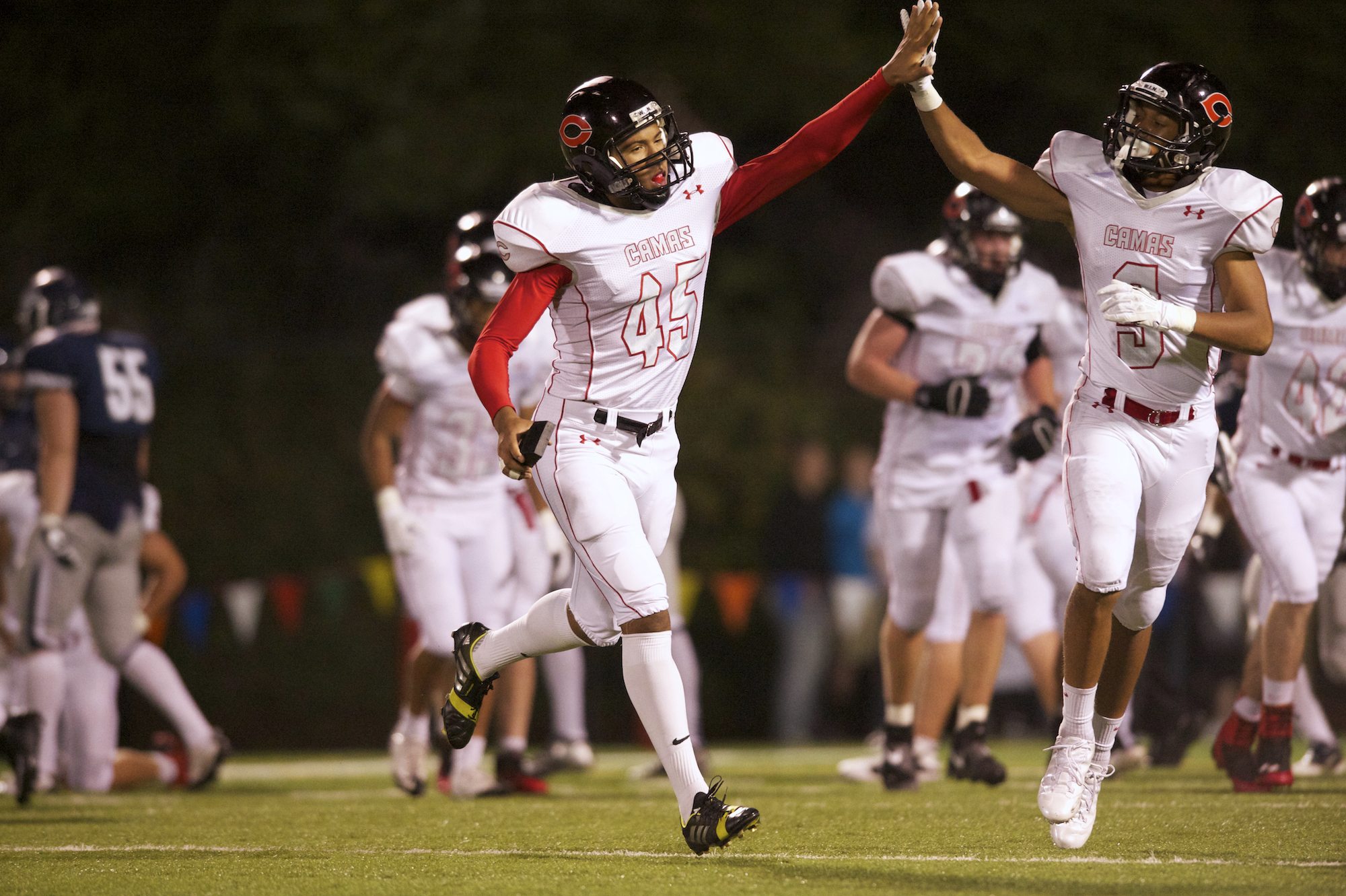 Kicker Caleb Lightbourn, #45, is congratulated after a field goal against Skyview, October 4, 2013.
