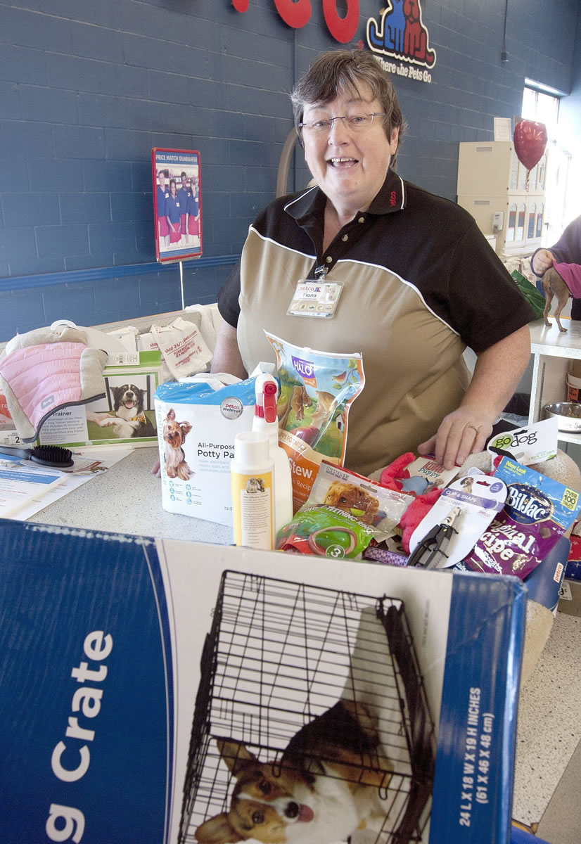 Fiona Korst, assistant store manager of Petco in Grand Forks, N.D., shows the starting supplies for a small breed dog.