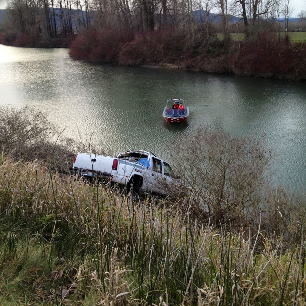 A cable was attached to the submerged pickup, which was pulled out of the water and impounded by the Cowlitz County Sheriff's Office.