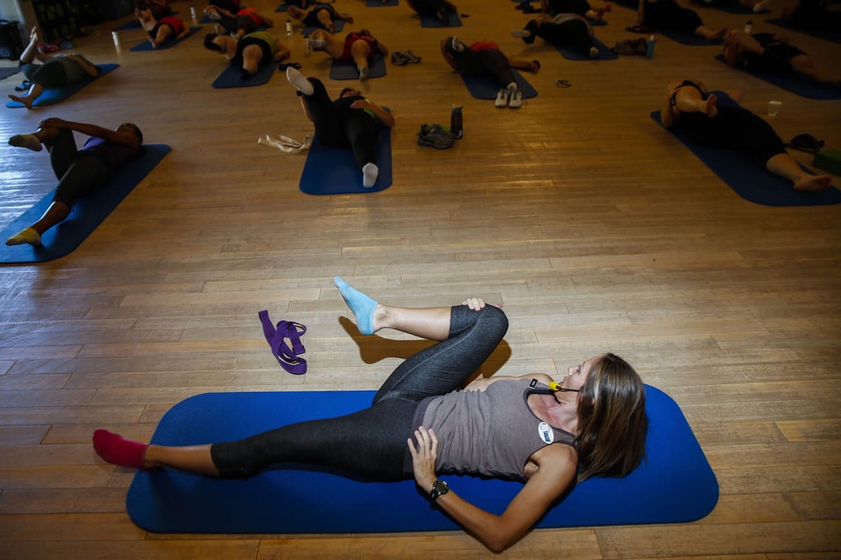 Karen Oliveri leads a stretching class at the Biggest Loser Resort at Fitness Ridge in Malibu, Calif., on Nov.