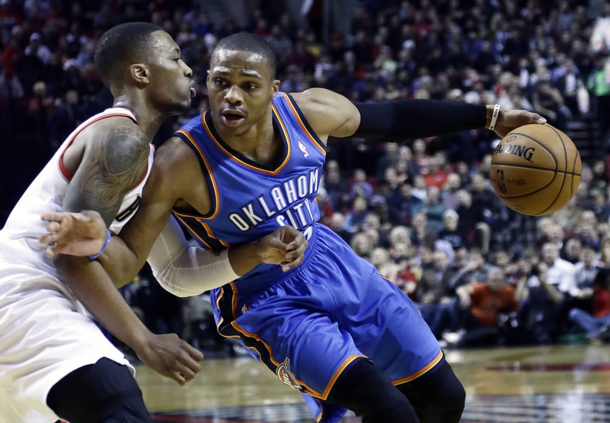 Oklahoma City Thunder guard Russell Westbrook, right, drives on Portland Trail Blazers guard Damian Lillard during the first half of a game on Dec.