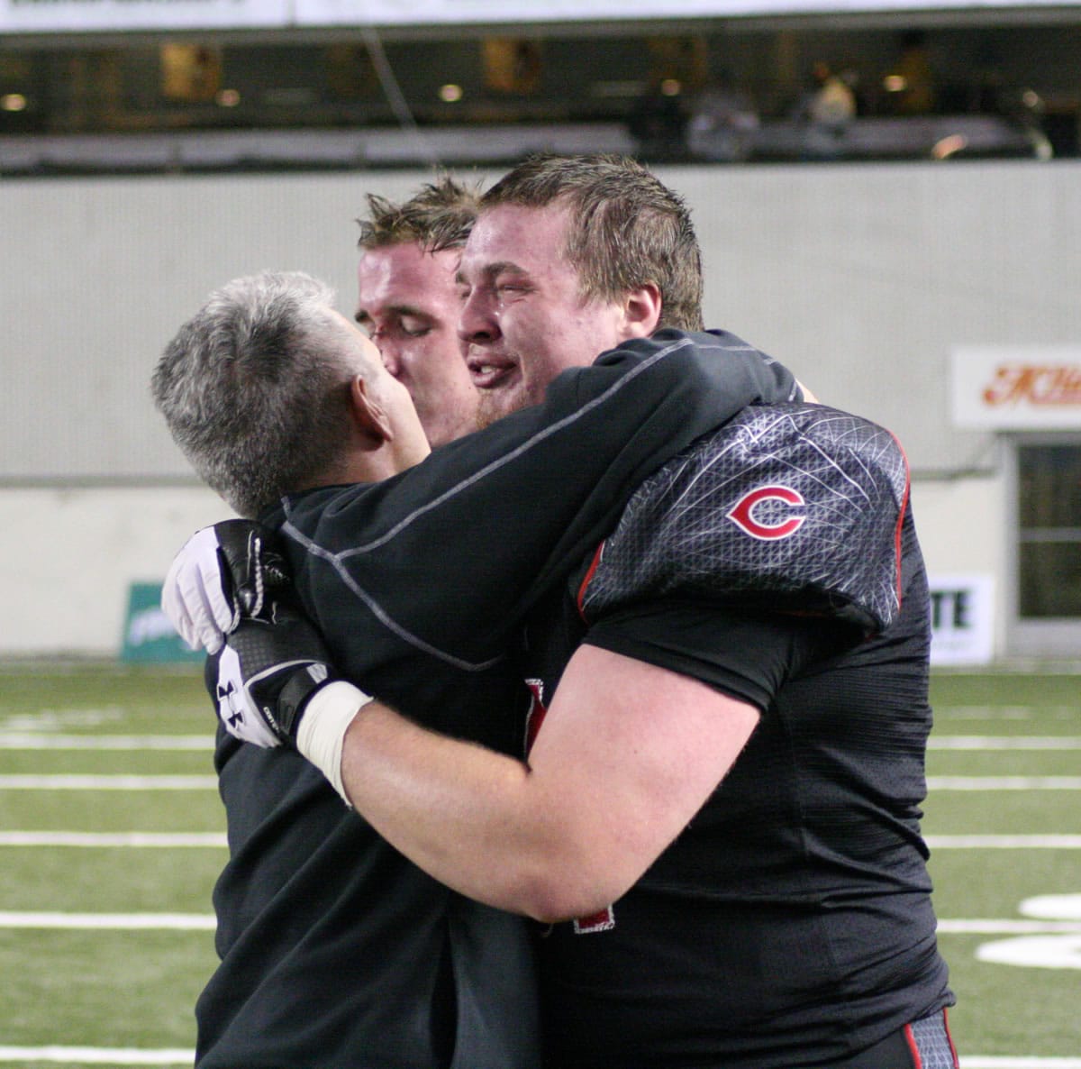 Coach Jon Eagle consoles Drew Clarkson and Matt Walser after an emotional and dejected end.