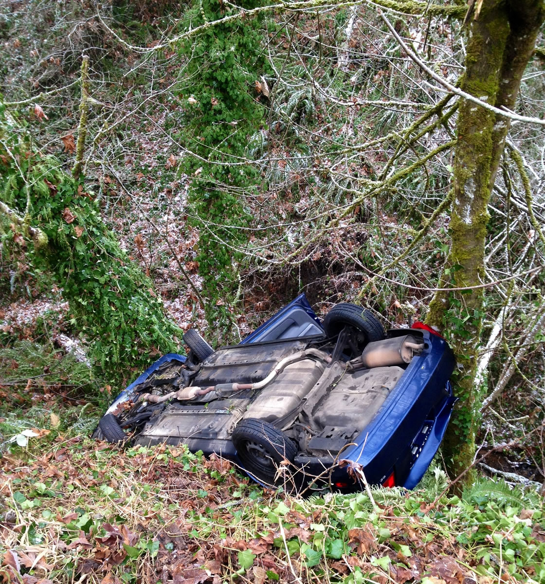 Firefighters found this vehicle suspended between two trees over an embankment near Northwest Coyote Ridge Road and Northwest 21st Avenue in La Center.