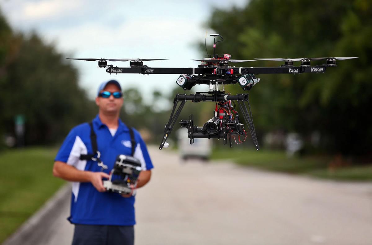 ReadyHeli.com technician and sales agent Brett Strand operates his own personal octacopter drone in Jupiter, Fla.,