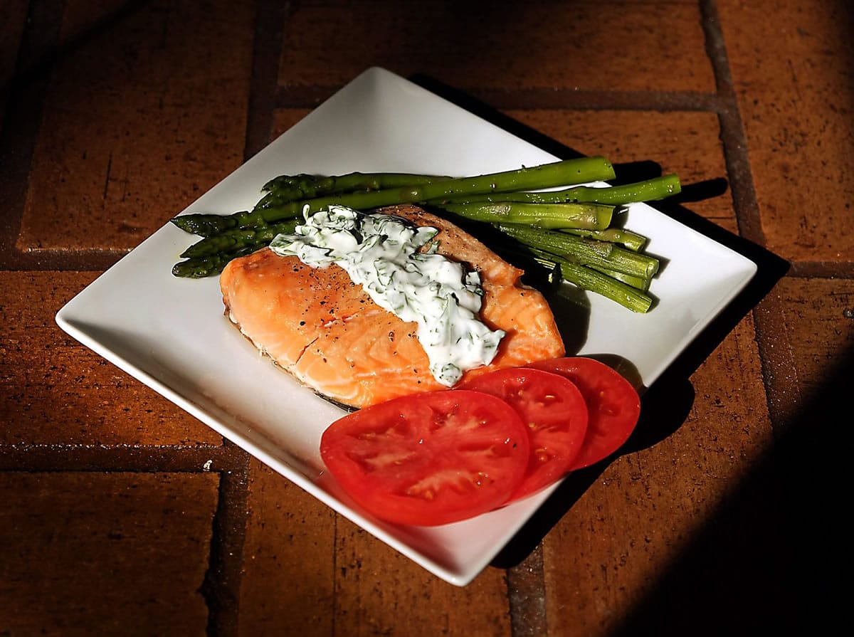 Roasting yields buttery salmon, top with an herb sauce that takes only minutes in a food processor.