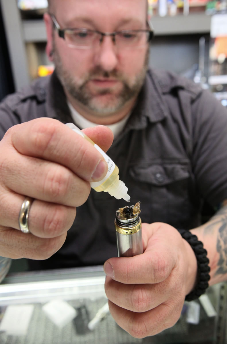 Matt Kostecki who helps out at the store Milwaukee Vapor as well as being a good customer of e-cigarettes and fluid, shows how to add the fluid known as e-juice to the e-cigarette