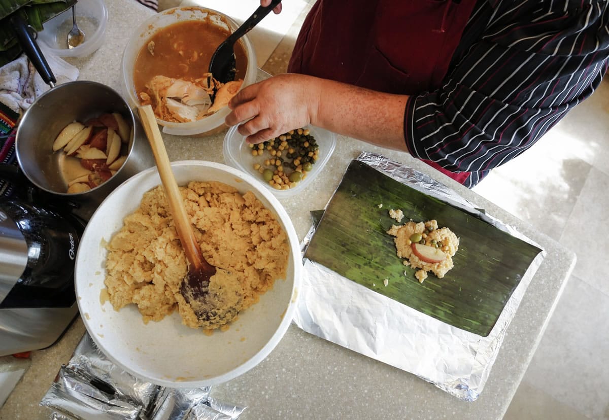 Ingredients are placed ready to fill as Dora Gonzales and her daughter, Cynthia, prepare traditional Salvadoran tamales from an ancient family recipe in Inglewood, Calif., on Dec.