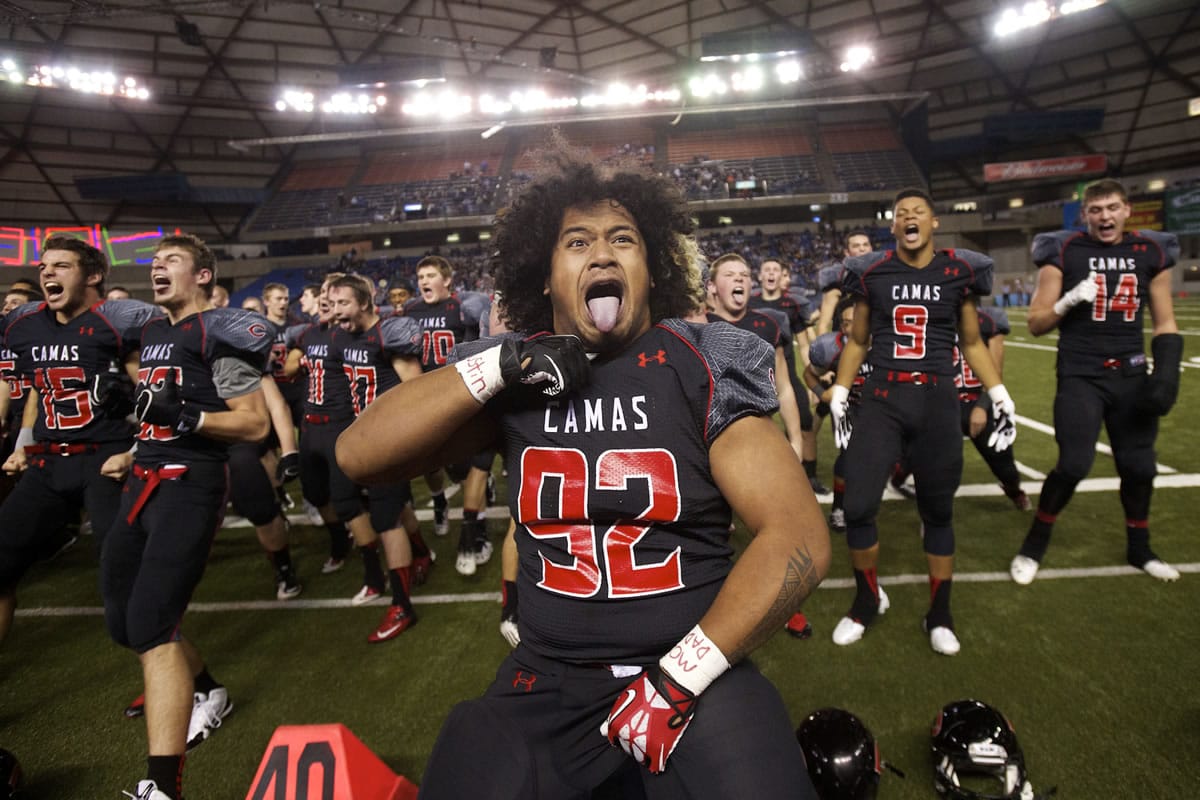 Jason Vailea leads the Camas football team through a pre-game Haka to get fired up to play Bellarmine Prep at the Tacoma Dome (Steven Lane/The Columbian)