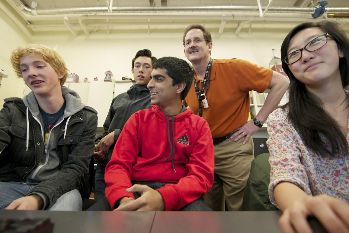 From left, Josh Shepherd, 16; Blake Brusch, 17; Daniel Rodricks, 17; teacher David Britton; and Christina Chow, 16, work together during an AP computer programing class at Union High School. After his retirement from Hewlett-Packard, Britton started volunteering in the classroom through nConnect's mentor program that matches high-tech professionals with schools that offer advanced courses.