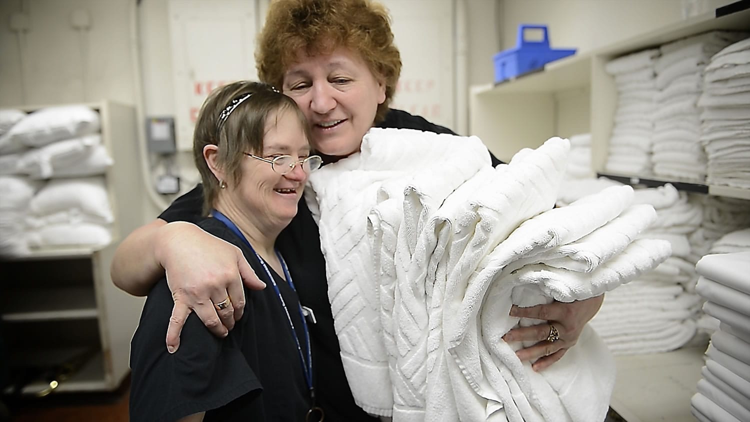 Shelli Fanning, left, shares a hug with supervisor Vera Babiy on Fanning's last day of work at the Red Lion Hotel Vancouver at the Quay. Fanning has Down syndrome but family and professional support helped her succeed at her housekeeping job for 23 years.
