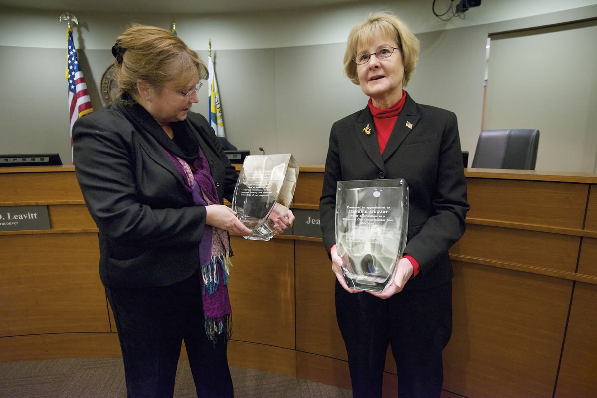 Vancouver City Councilors Jeanne Harris, left, and Jeanne Stewart admire engraved vases presented to them Monday at a meeting at City Hall.