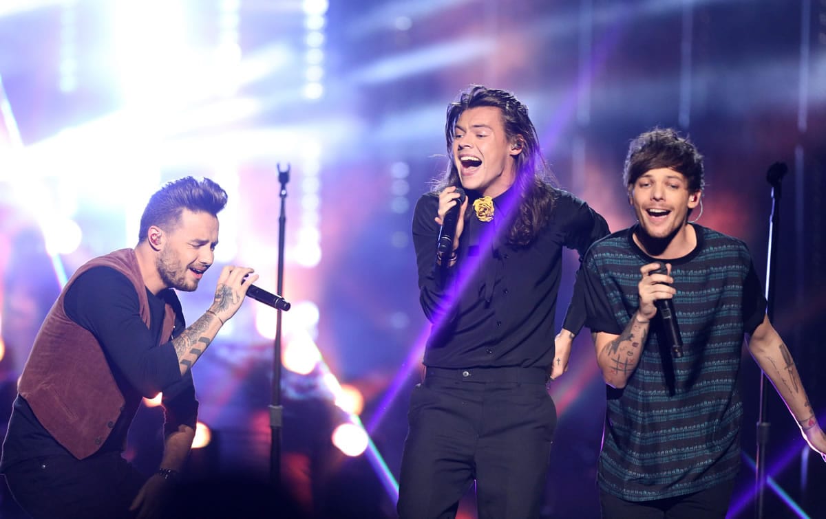Liam Payne, from left, Harry Styles, and Louis Tomlinson of One Direction perform at the American Music Awards at the Microsoft Theater on Sunday in Los Angeles.