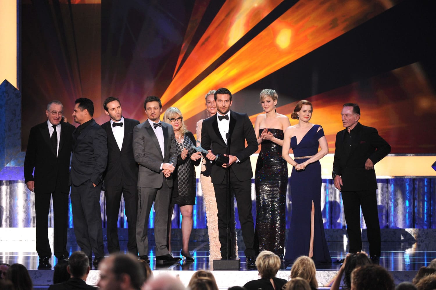 From left, Robert De Niro, Michael Pena, Alessandro Nivola, Jeremy Renner, Colleen Camp, Elisabeth Rohm, Bradley Cooper, Jennifer Lawrence, Amy Adams and Paul Herman accept the award for outstanding performance by a cast in a motion picture for &quot;American Hustlei&quot;at the 20th annual Screen Actors Guild Awards at the Shrine Auditorium.