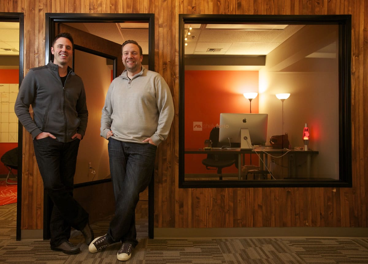 Ambient Media founders Steve Cross, left, and Matt Cole stand in their downtown Vancouver office Jan. 22.
