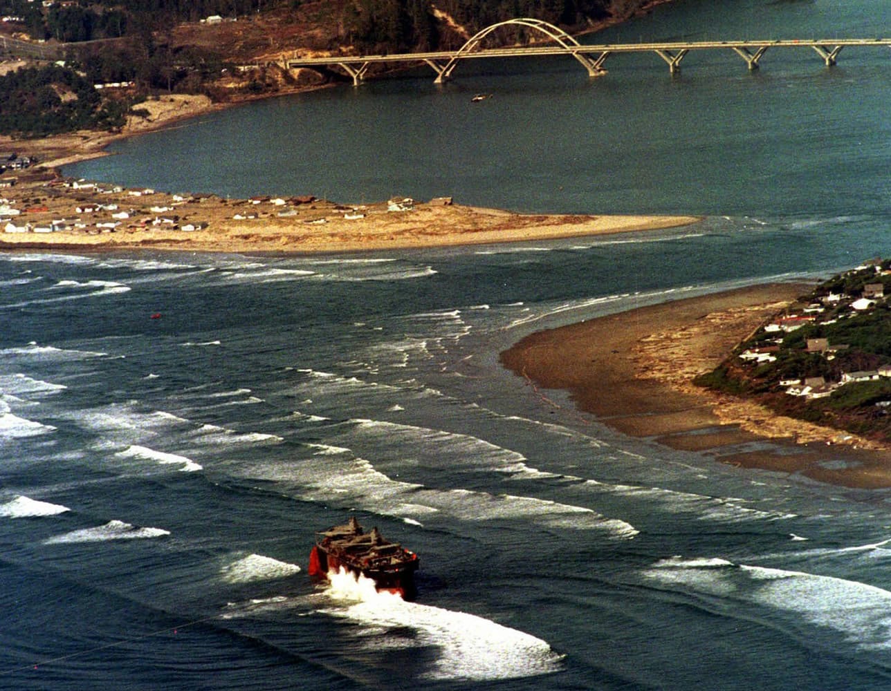 Photos by Don Ryan/Associated Press files
Waves crash against the broken New Carissa's bow near the entrance to Alsea Bay in Waldport, Ore., on March 6, 1999.