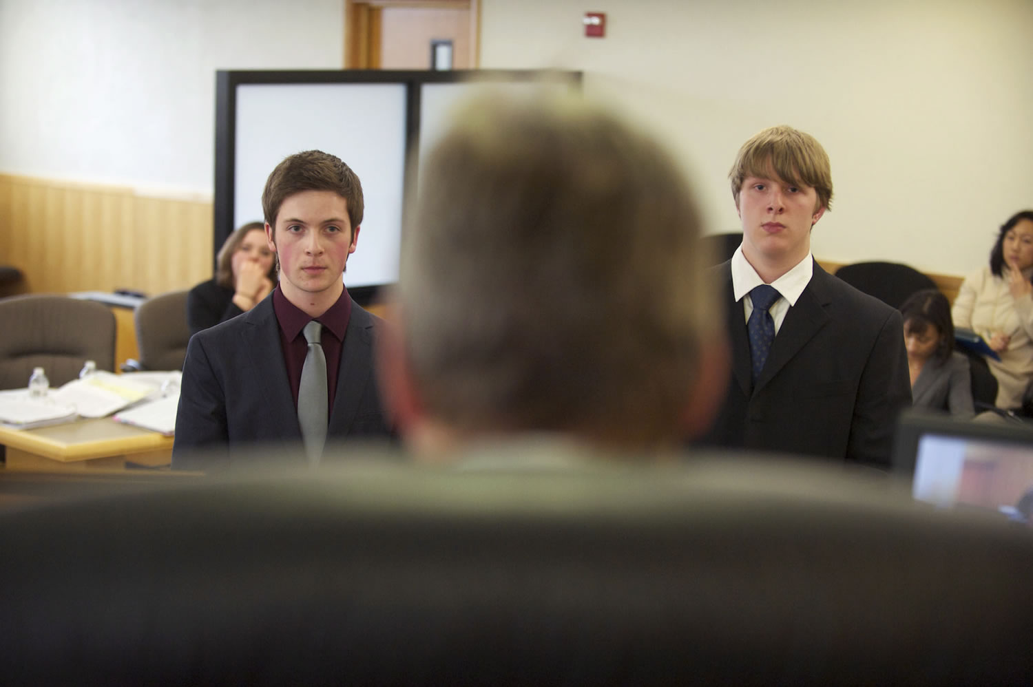 Camas High School's Max Urbanek, left, and Columbia River's Jordan Andrieu play the part of attorneys as the stand in front of Clark County Superior Court Judge Daniel Stahnke as they take part in a mock trial Thursday.