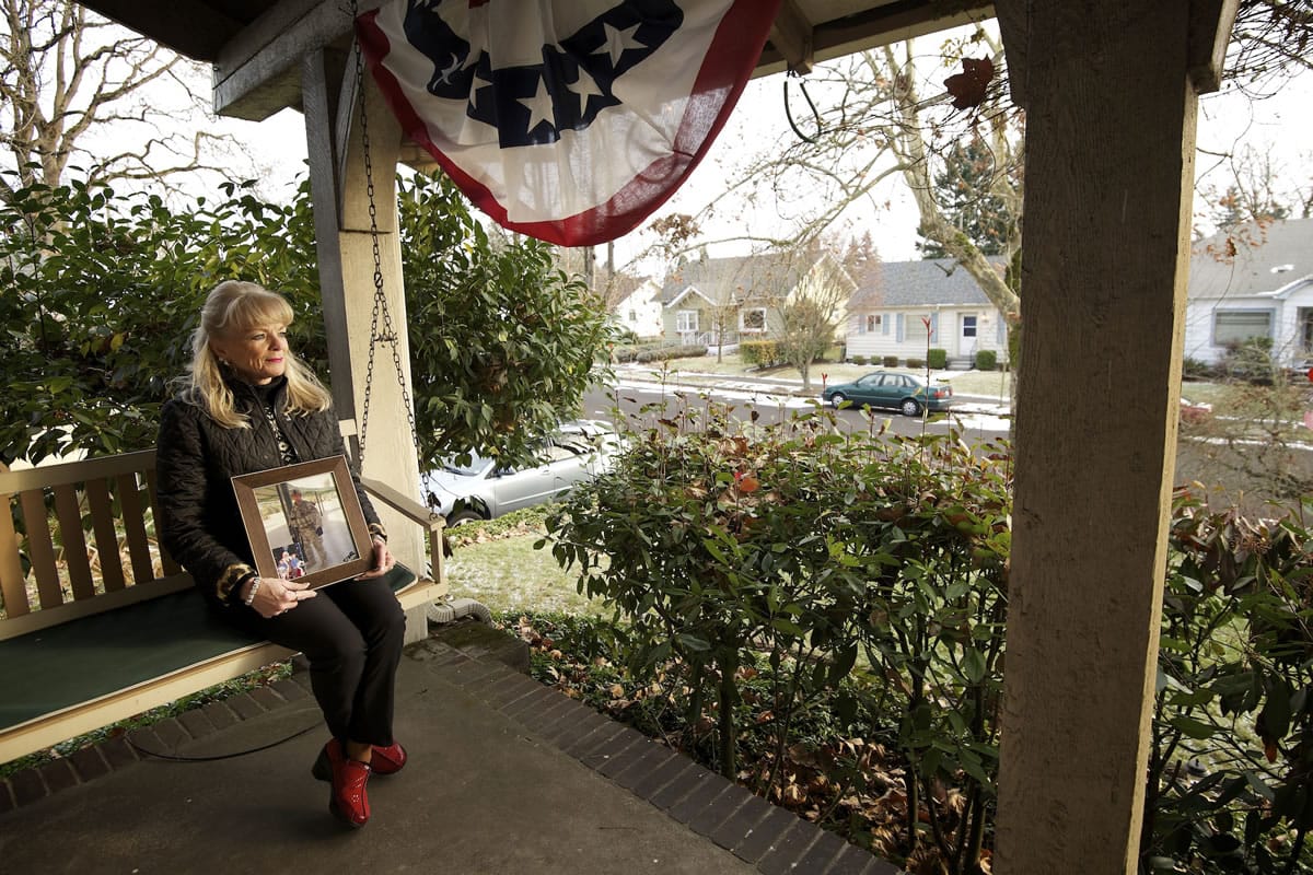 Jann Byrd holds a portrait of her oldest son, U.S. Army Maj. William F. Byrd IV, outside her Lincoln neighborhood home. In late November, Jann Byrd learned that someone had stolen her American flag from her yard.