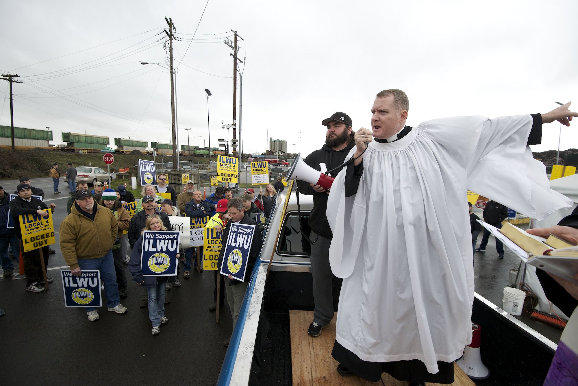 Father Jeremy Lucas of Christ Church Parish of Lake Oswego, Ore., speaks to locked-out Longshore workers from ILWU Local 4 during an Ash Wednesday protest outside the United Grain terminal at the Port of Vancouver.
