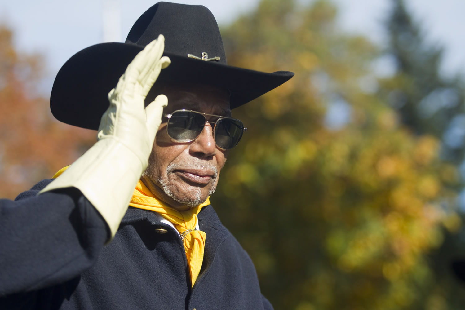 William Morehouse, WWII veteran from the Buffalo Soldiers Pacific Northwest Chapter, salutes as he marches in the 28th Annual Veterans Parade at Fort Vancouver on Nov.