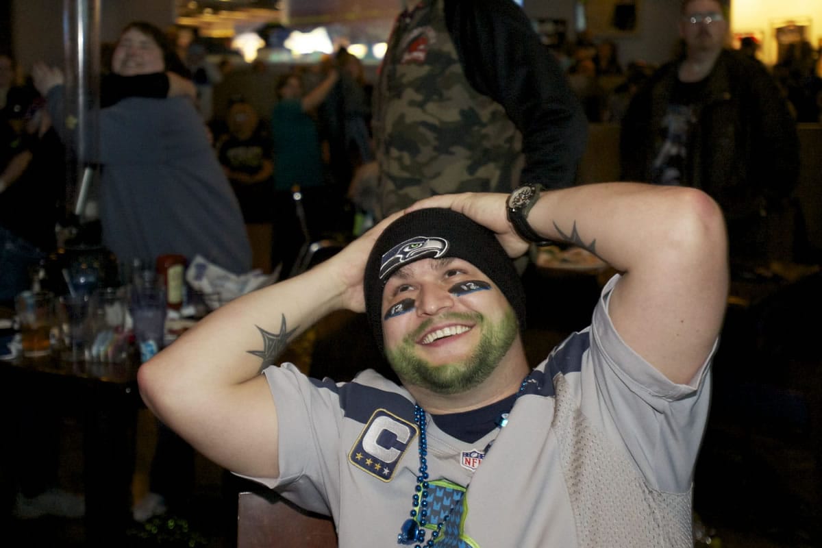 Seahawks fan Mike Gutierrez enjoys the win after watching Super Bowl XLVIII at Big Al's on Sunday.