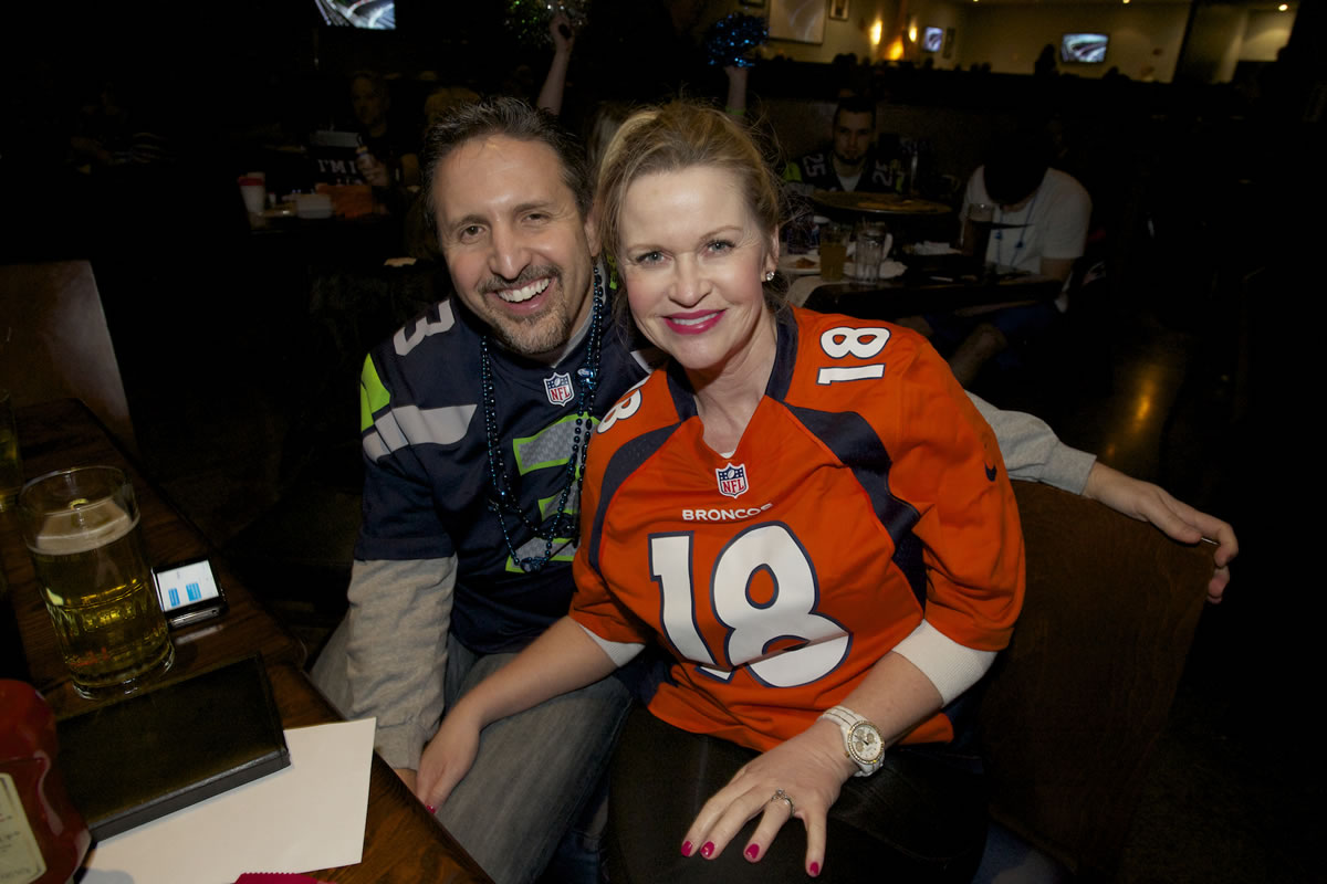 Aaron Kraft and his wife, Peggy Kraft, try to get along  while watching Super Bowl XLVIII at Big Al's, Sunday.