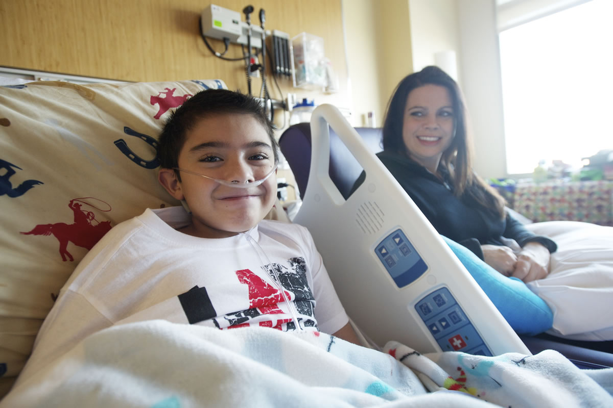 Alex Campbell, 9, with his mom, Mandy Campbell, was transported recently from Randall Children's Hospital at Legacy Emanuel in Portland to Texas Children's Hospital.