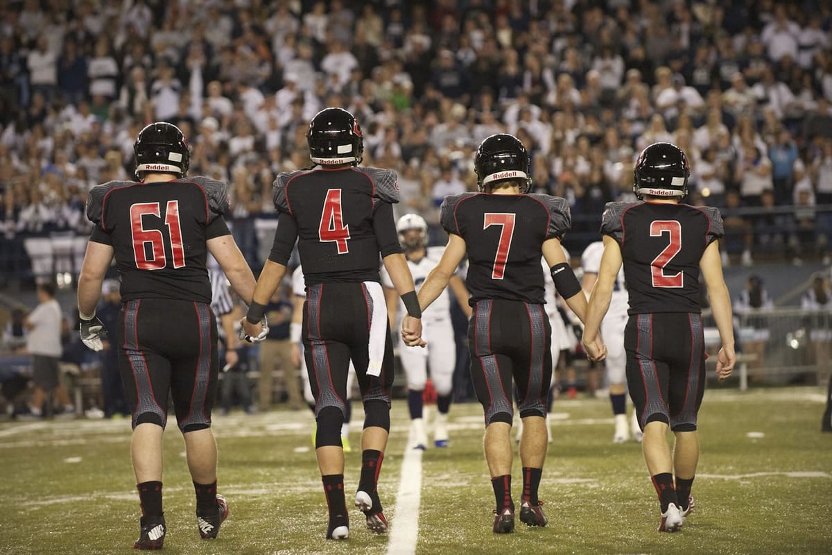 Camas captains, from left, Drew Clarkson, Reilly Hennessey, Nate Beasley and Zach Eagle take the field for the final time for the coin toss of the State 4A championship game at the Tacoma Dome, Saturday, December 7, 2013.