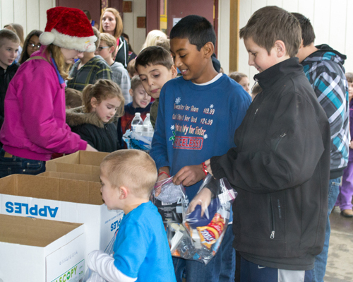 Ridgefield: Union Ridge Elementary School students assemble bags of supplies for the less fortunate at a special 2013 holiday event the school held instead of a traditional party.