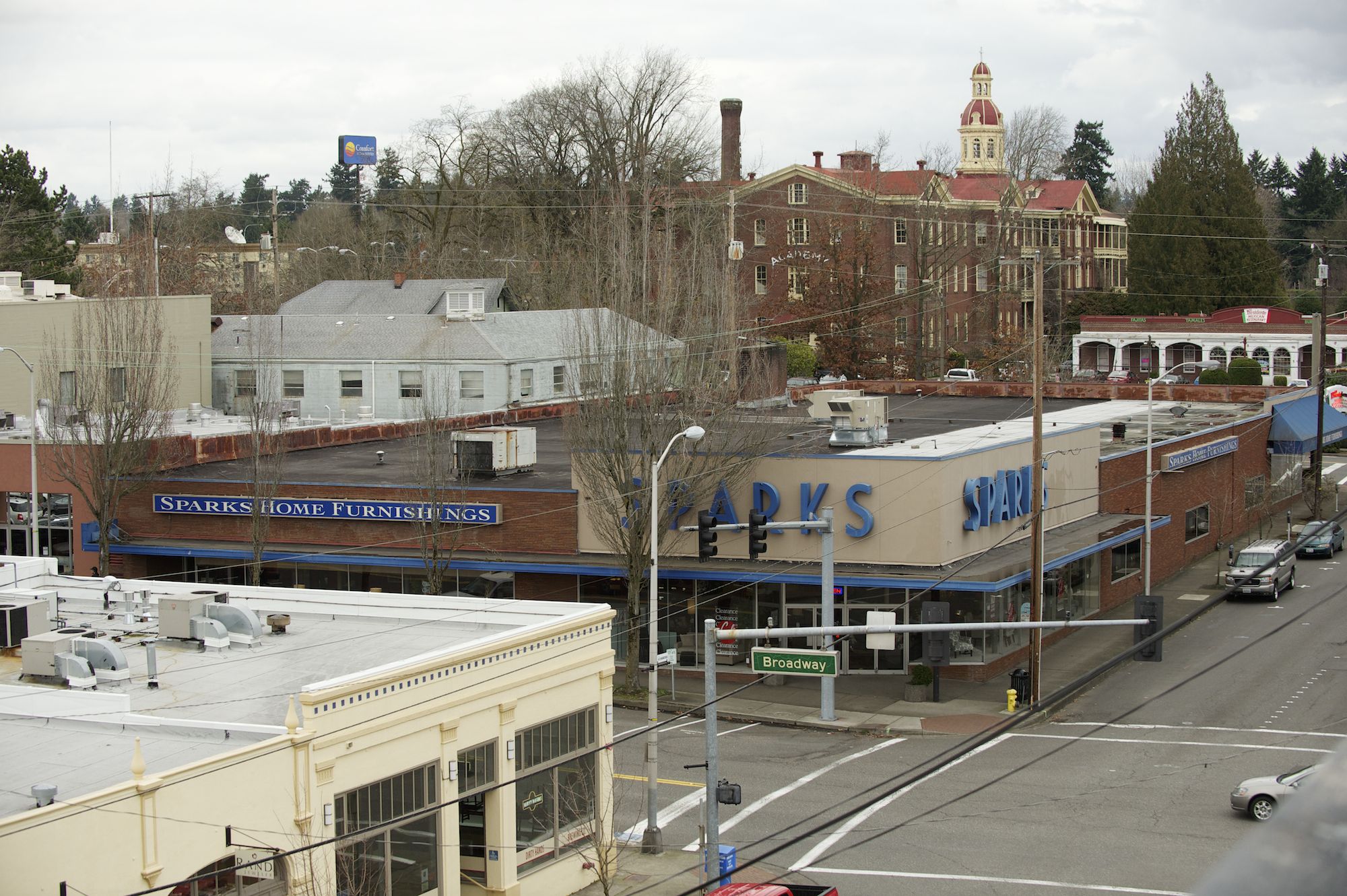 The Sparks Home Furnishings site is across from the historic Academy building, in the background, now the subject of a $10.6 million purchase and restoration campaign, and also is close to Vancouver's new public library (not shown).