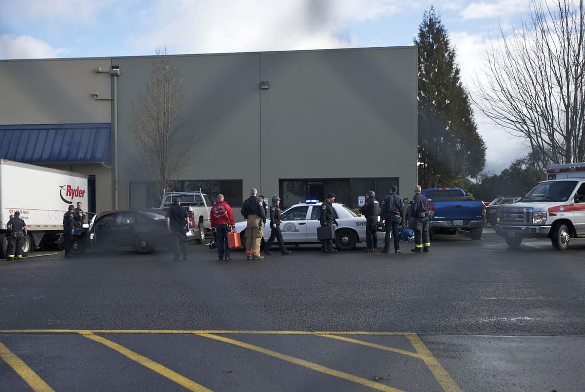 Police secure the scene of Monday's shooting at Benjamin Moore Paints in west Vancouver.