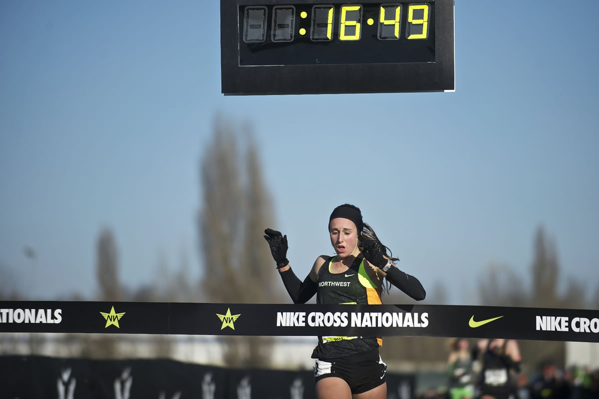 Camas' Alexa Efraimson crosses the finish line first at the Nike Cross National cross country meet and wins the national high school title at Portland Meadows on Saturday.