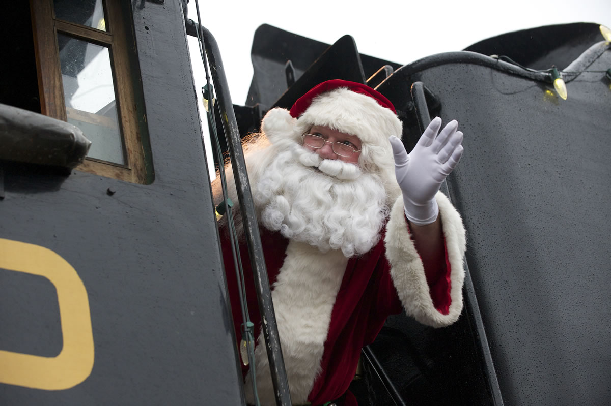 Santa Claus arrives on the SP&amp;S 700 steam locomotive, Saturday, December 15, 2012.