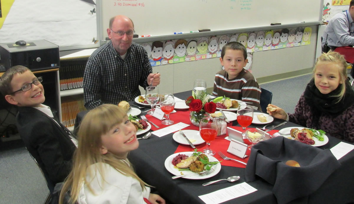 Battle Ground: Captain Strong Primary third-graders Emma Koppe, from left, Austin Lassiter, Felix Extrada and Ella Schlect eat a fancy four-course meal Dec.