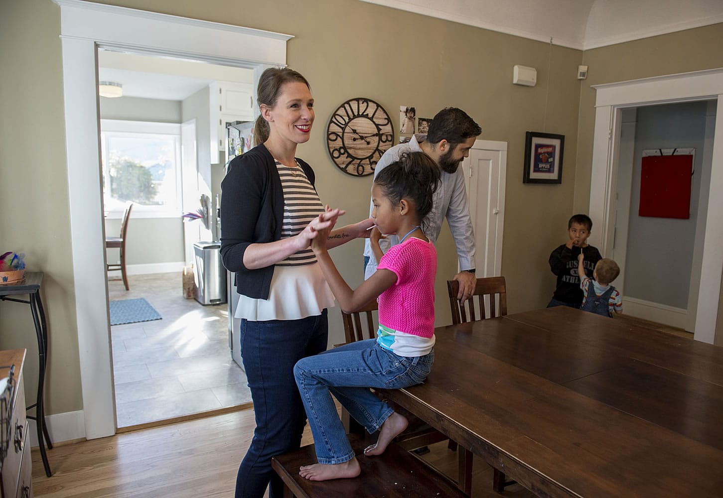 Sarah Desjarlais, left, hangs out with her daughter, Avi, 6, as her husband, Zachery, keeps an eye on Anthony, 6, and Atticus, 3, at their home in Vancouver.