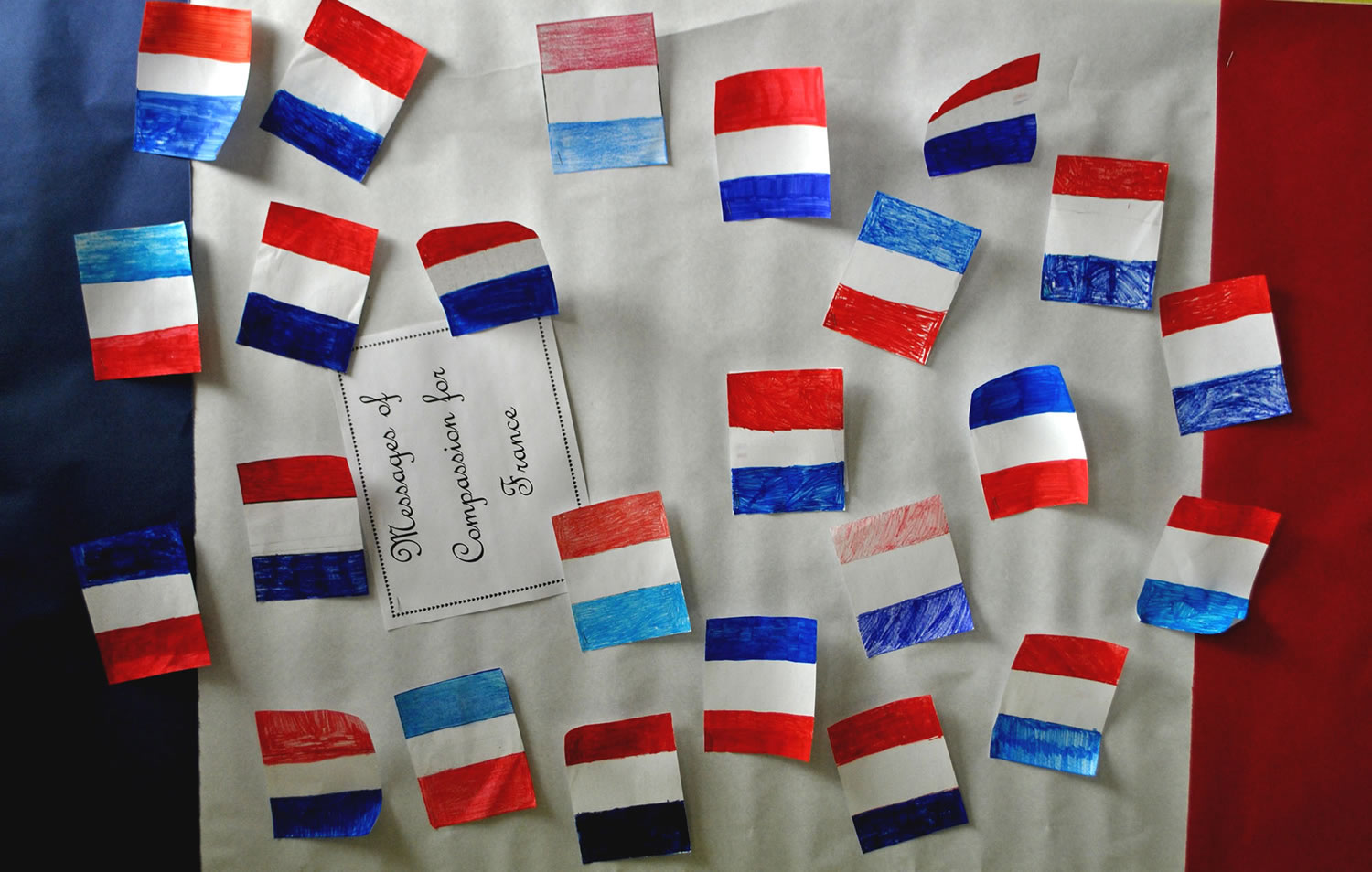 Battle Ground: After the attacks in Paris, River HomeLink art teacher Traci Donahue had her students make tiny French flags, write letters and paint French landmarks, and shipped over the care package to a school in Paris.