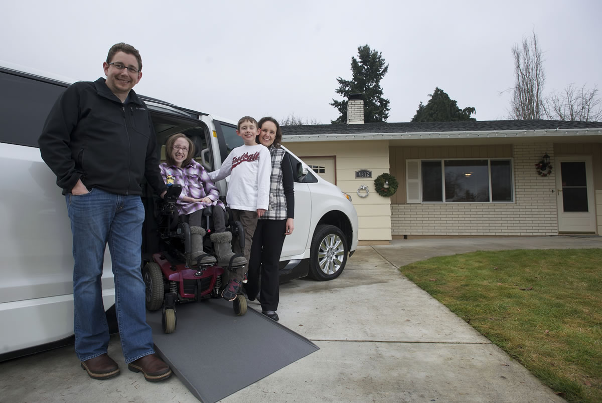 Eric, 12-year-old Emily, 7-year-old Daniel and Triann Benson smile about the new addition to their Minnehaha-area household: a specially retrofitted Toyota Sienna minivan. An anonymous donor made the $25,000 down payment on the customized $75,000 vehicle, which will allow Emily's parents to take her with them when they go on trips short and long -- just like any other kid.