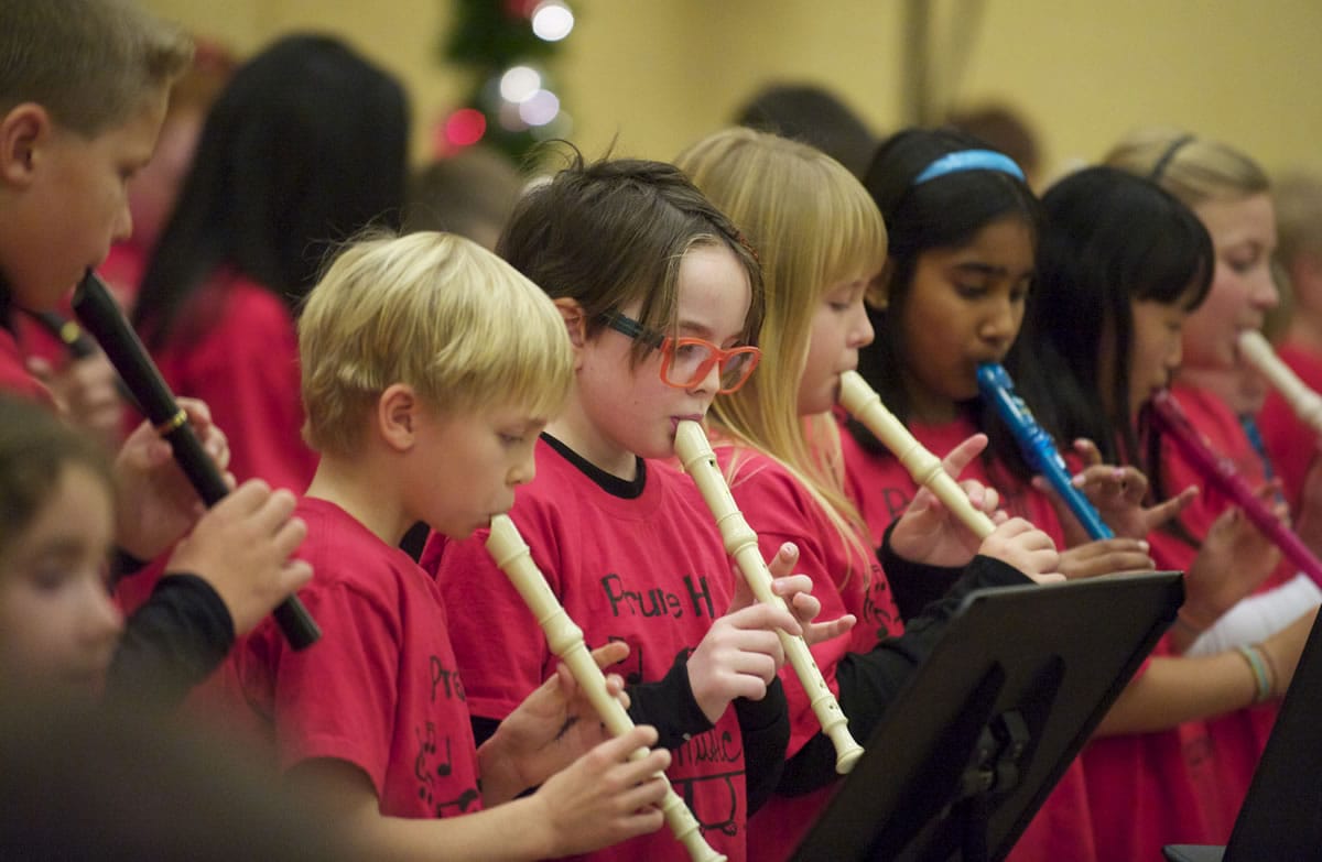 Fourth- and fifth-graders from Prune Hill Elementary School in Camas play recorders Saturday during a musical program at the annual Festival of Trees at the Hilton Vancouver Washington.