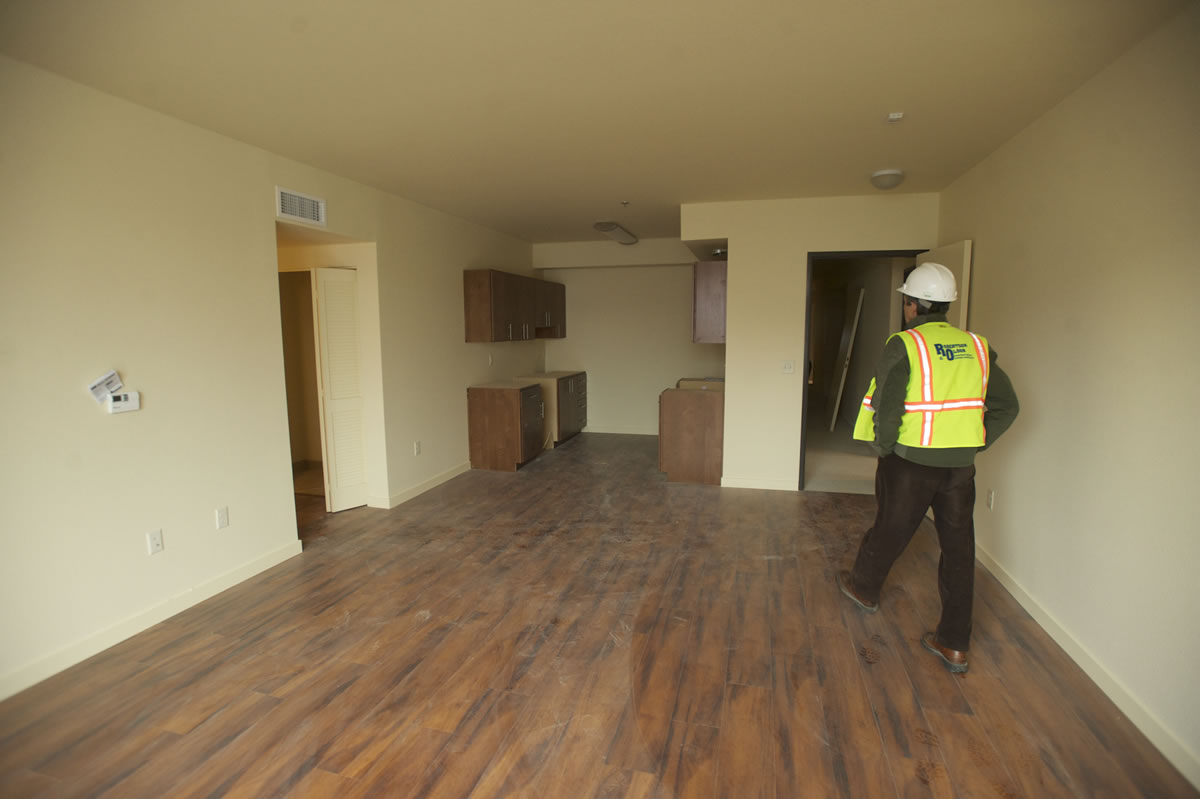 Charles Johnston, construction project manager from Prestige Development, tours one of 96 apartment units at Prestige Place, set to open in early 2014.