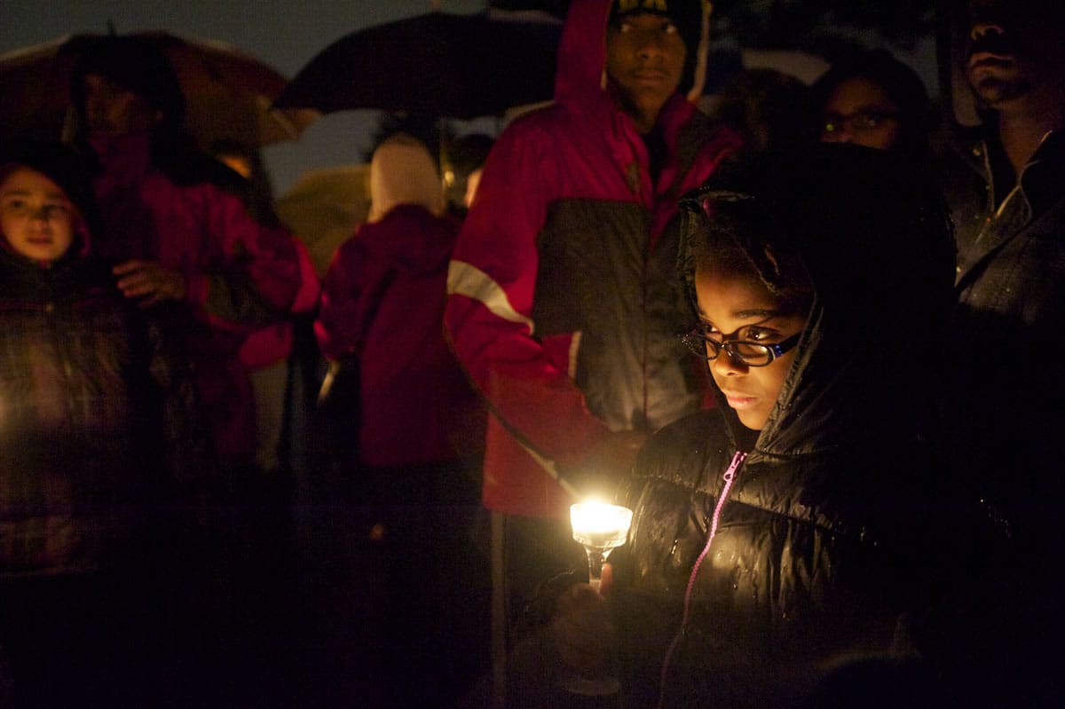 Harmony Jones participates in a candlelight vigil for Donna Franchino, the victim of a fatal house fire Friday.