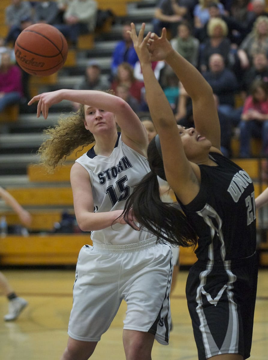 Skyview's Neesen Bristow blocks a shot, but was called for a foul on the play against Union's Kili Anderson in the first half Friday.