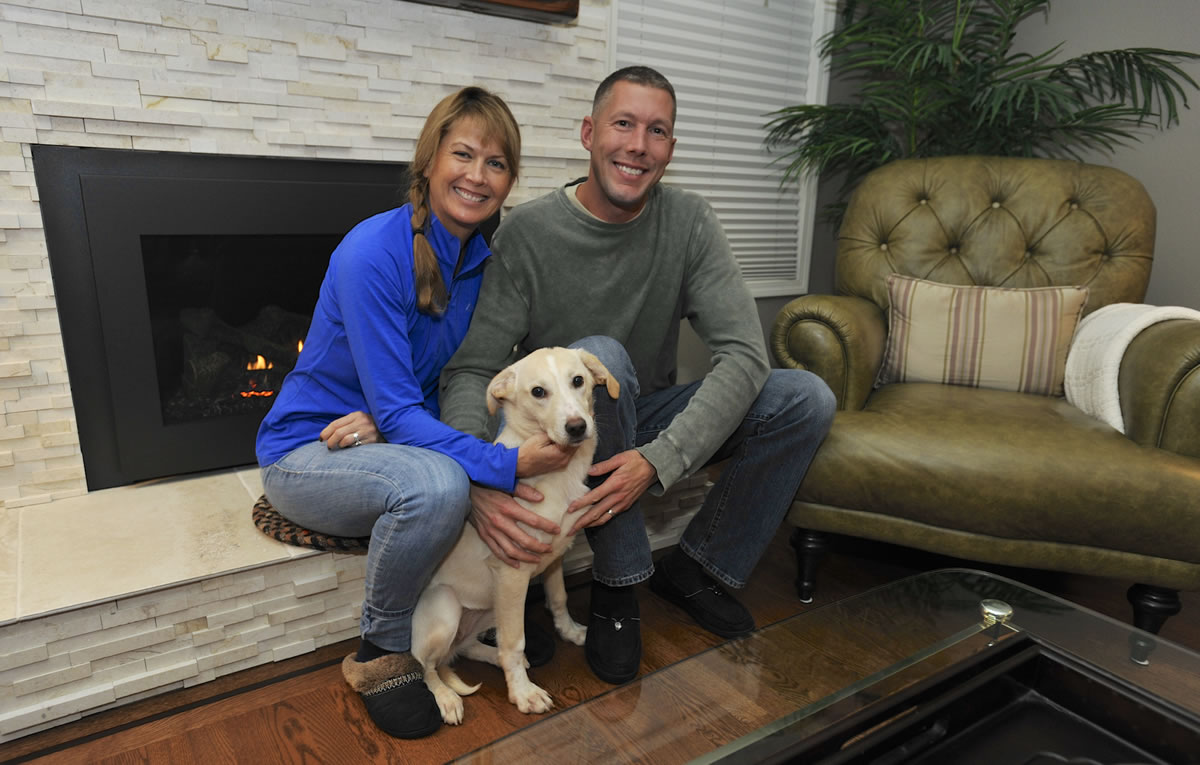 Sara and Josh Boelter with Luna, the dog they adopted through Operation Bagdad Pups, who Josh met while serving with the Oregon Air National Guard in Romania.