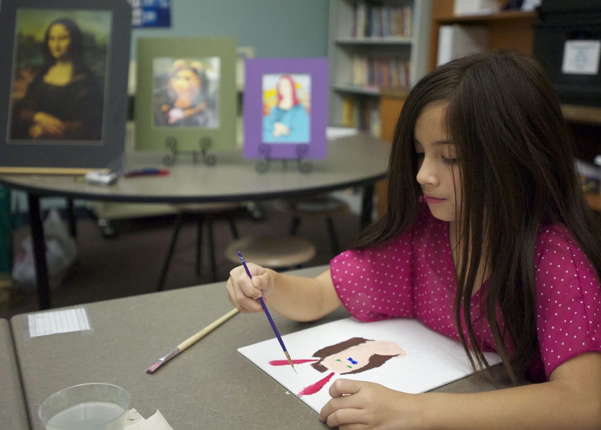 Lily Ngo, 9, paints &quot;Mona Rabbit.&quot; Ngo said she always imagined the Mona Lisa with rabbit ears.