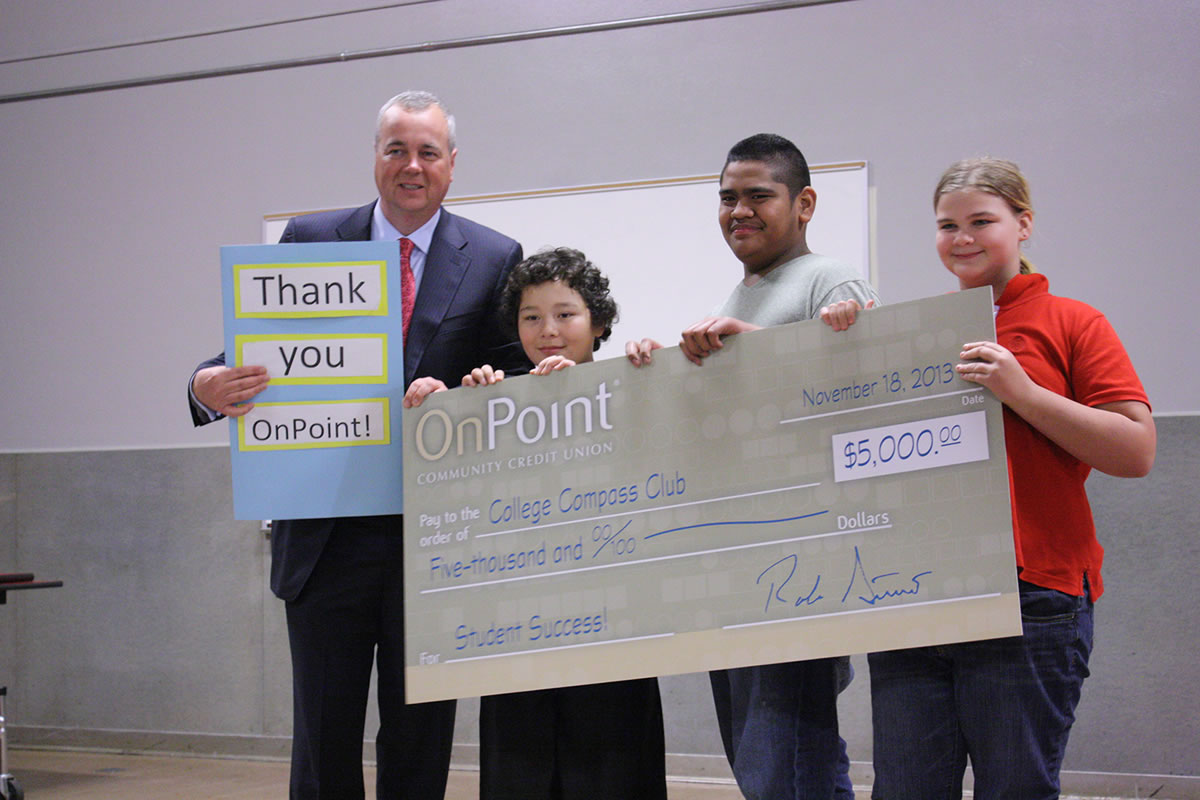 Vancouver Heights: OnPoint Community Credit Union President Robert Stuart, from left, presents a $5,000 donation Nov.