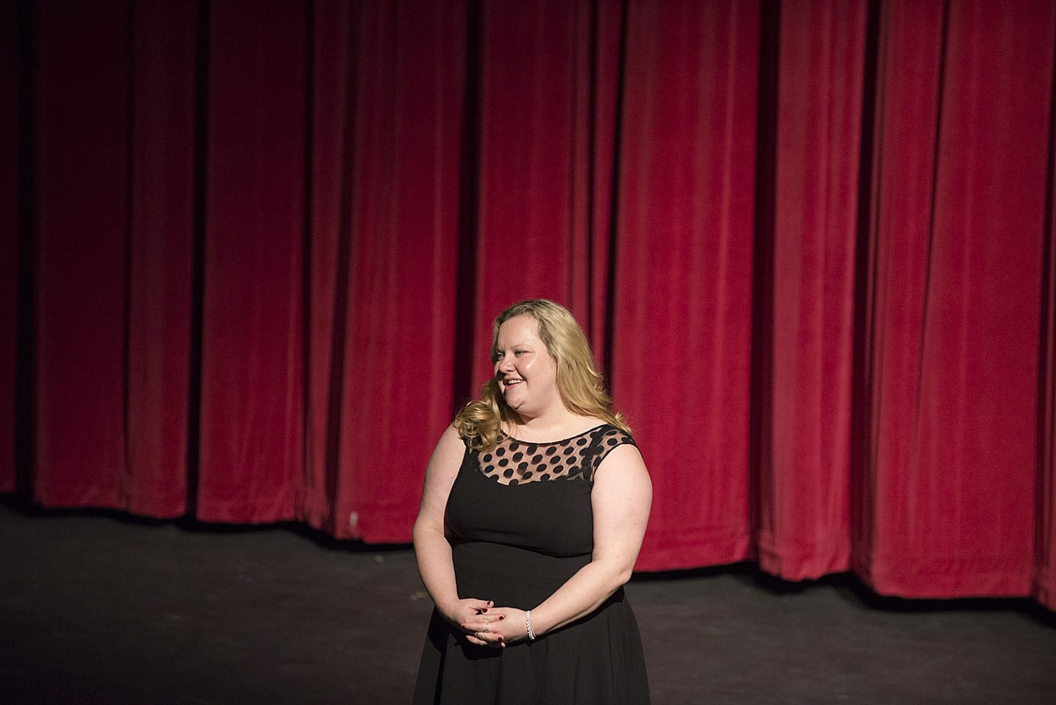 Director Margaret Gorman, Evergreen High School's new drama teacher, greets the audience before "The Three Musketeers" on Thursday at Evergreen High School's theater.