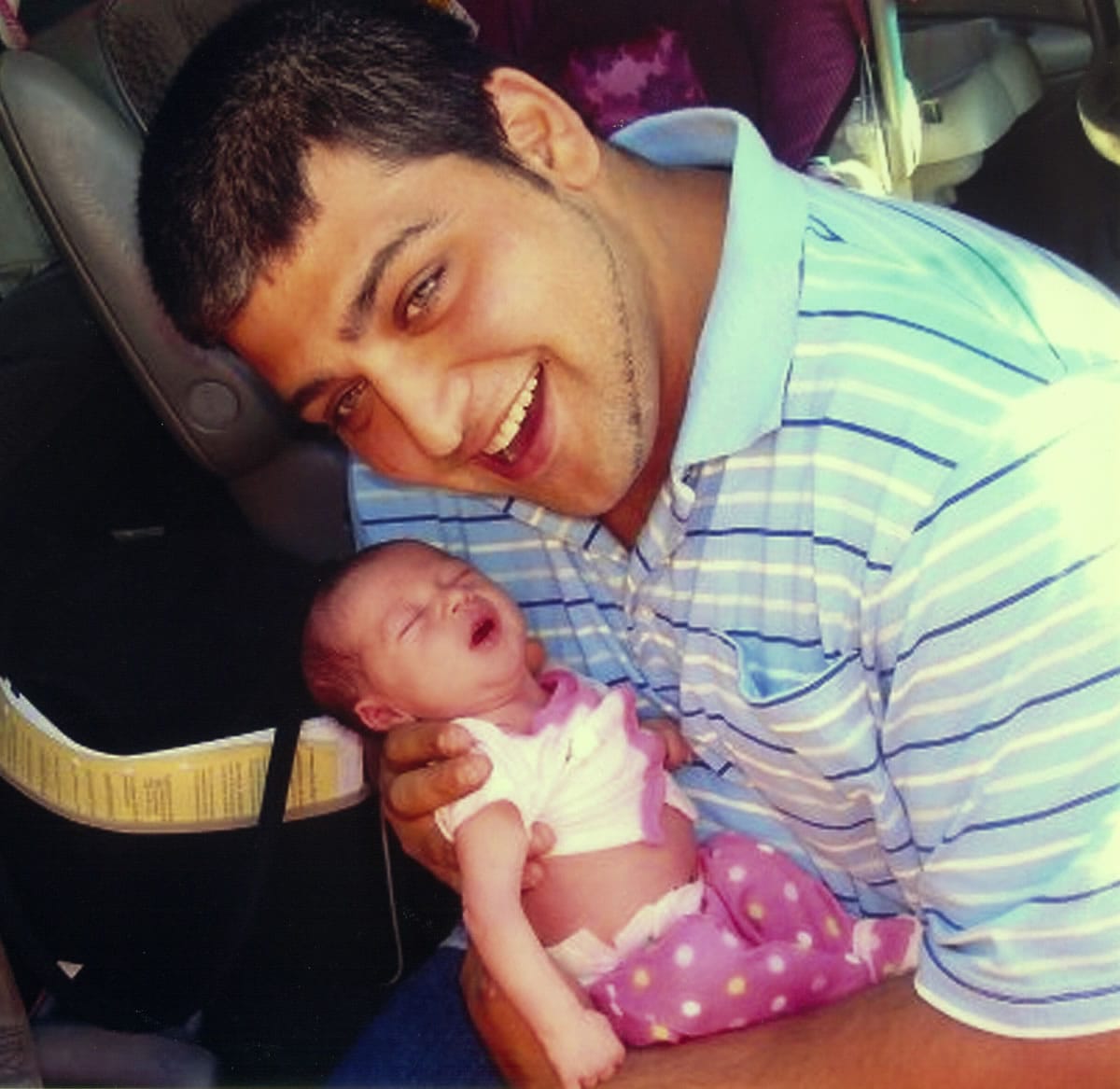 Joshua Schenk, who was killed in 2012, holds his niece, Mirra, in 2009.
