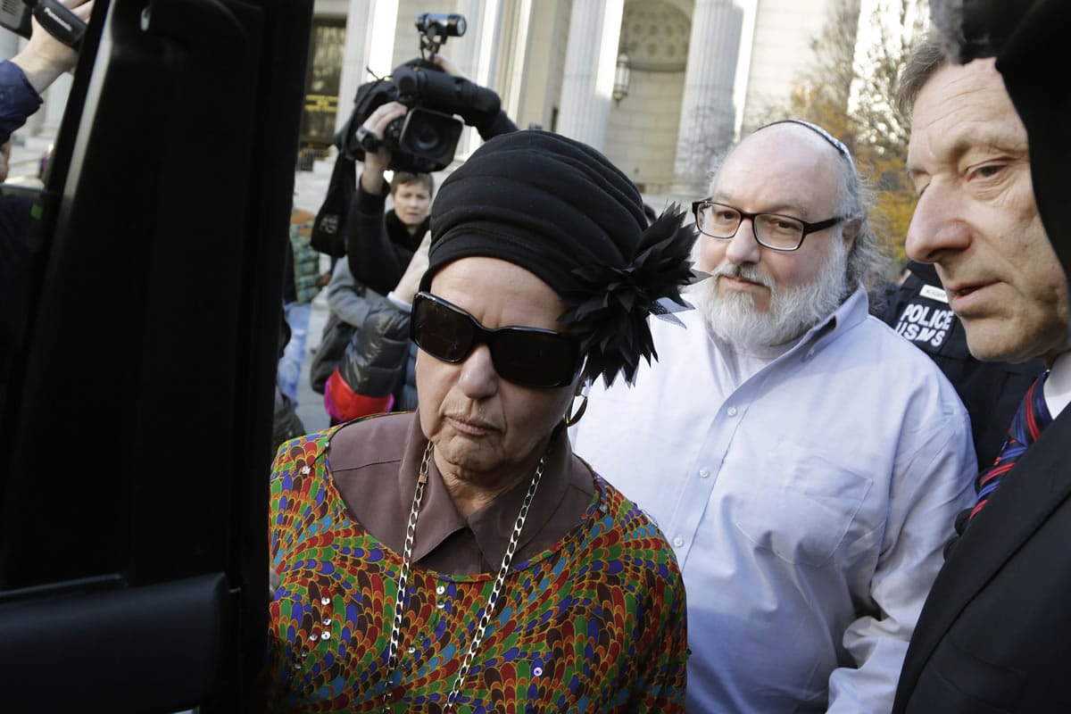 Convicted spy Jonathan Pollard and his wife, Esther, leave the federal courthouse in New York on Friday. He served 30 years for selling intelligence secrets to Israel.