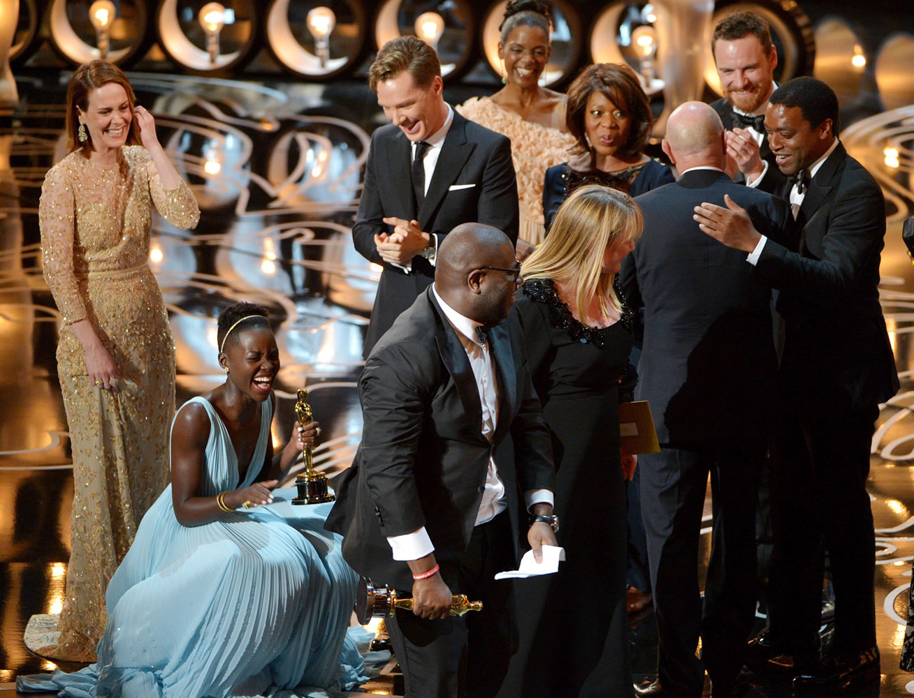Sarah Paulson and Lupita Nyong'o, second from left, celebrate after accepting the award for best picture of the year for &quot;12 Years a Slave&quot; during the Oscars at the Dolby Theatre on Sunday in Los Angeles.