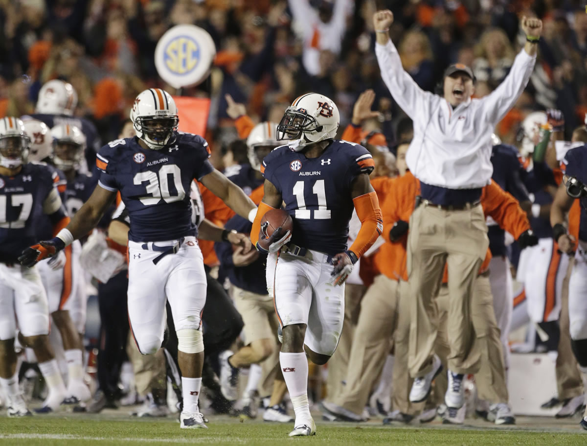 Auburn cornerback Chris Davis (11) returns a missed field-goal attempt 100-plus yards to score the game-winning touchdown as time expired.