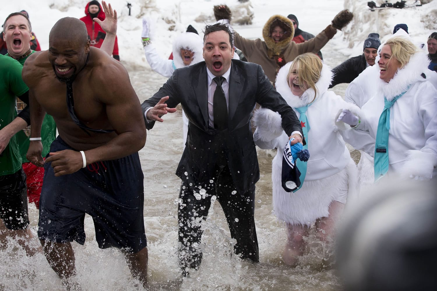 &quot;The Tonight Show&quot; host Jimmy Fallon, center, exits the water during the Chicago Polar Plunge on Sunday.